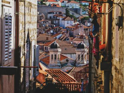 Picturesque view of Dubrovnik's historic red-tiled rooftops and narrow streets.