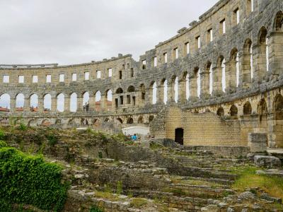 Explore the historic Roman amphitheater ruins in Pula, a major tourist attraction in Croatia.