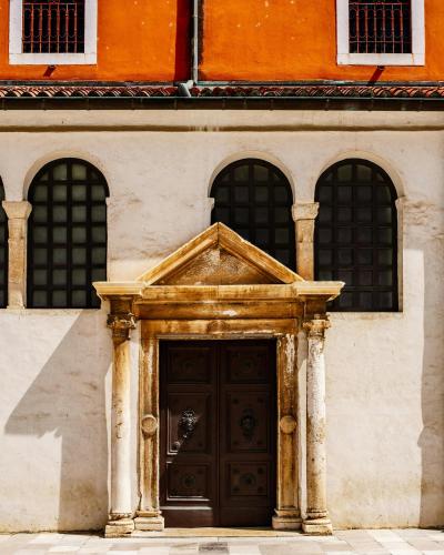 Ornate stone doorway of a historic church in sunny Zadar, Croatia.