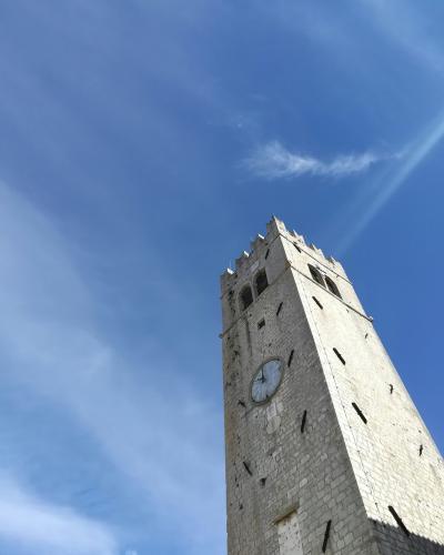 brown concrete tower under blue sky during daytime