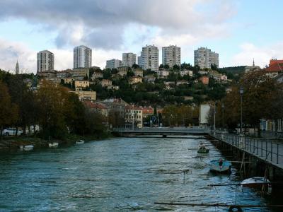 body of water near city buildings during daytime