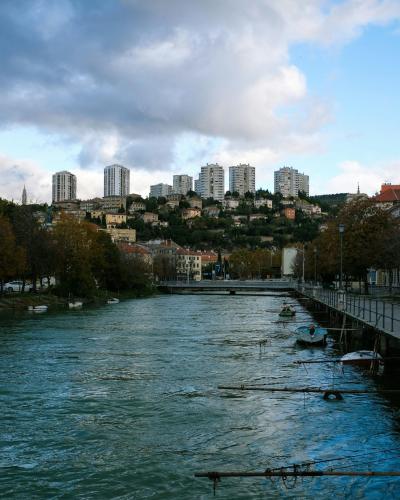 body of water near city buildings during daytime