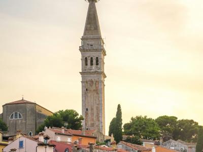 a tall clock tower towering over a city