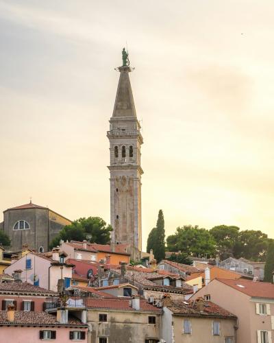 a tall clock tower towering over a city