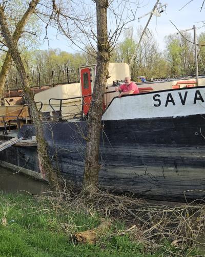 River ship "Sava" parked on banks of river Lonja